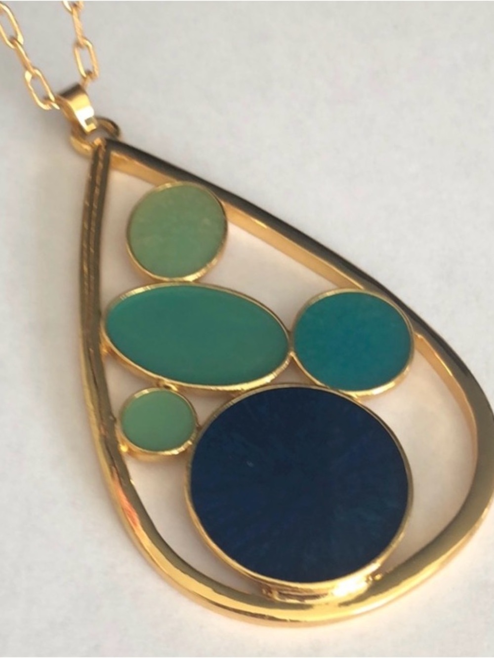 Trina Turk gold and blue enamel pendant necklace